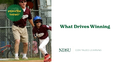 Young boy in baseball uniform running with coach in background pointing